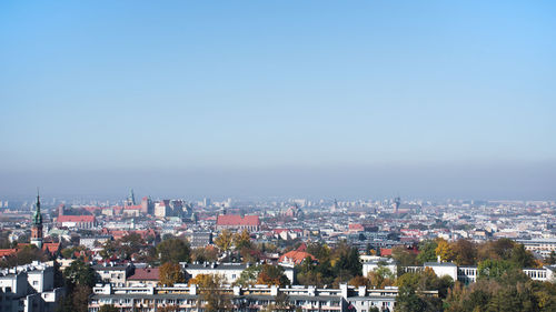 High angle view of townscape against clear blue sky