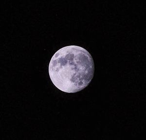 Close-up of moon against clear sky at night