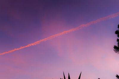 Low angle view of vapor trails in sky
