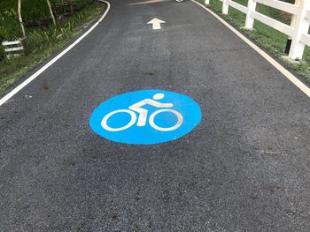 High angle view of bicycle sign on road