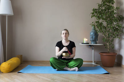 Woman meditating at home
