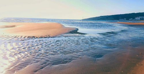 High angle view of man relaxing on beach against sky