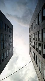 Low angle view of building against cloudy sky