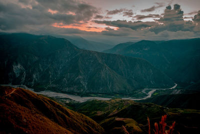 Scenic view of mountains against sky during sunset