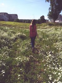 Woman standing on field