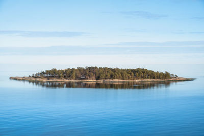 Scenic view of island against sky