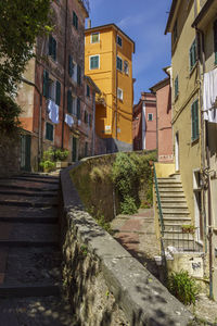 Street amidst buildings against sky