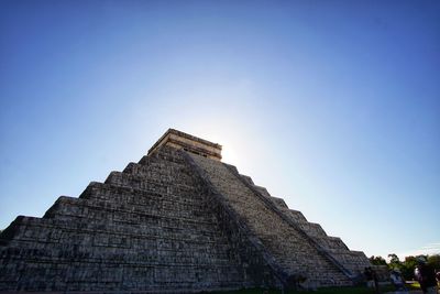 Low angle view of historical building against blue sky