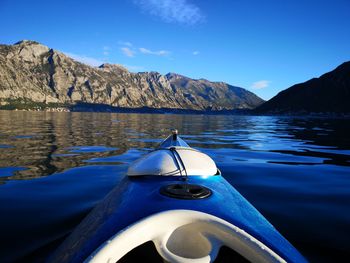 Boat in lake against blue sky