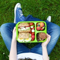 Low section of young man eating