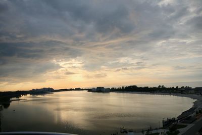 Scenic view of river against sky during sunset