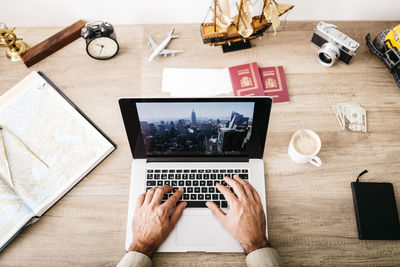 Man sitting at his desk planning his next journey