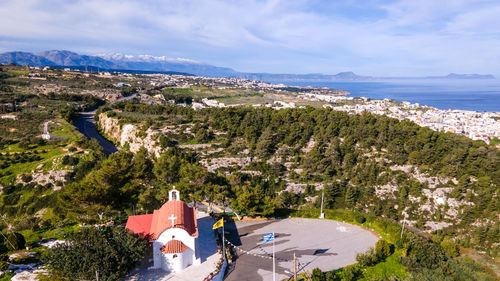 High angle view of trees by sea against sky