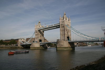 Tower bridge over thames river against sky