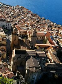 High angle view of houses in town against sky