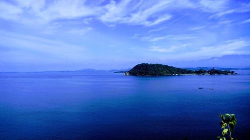 Scenic view of sea against blue sky