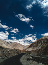 Road amidst landscape against sky