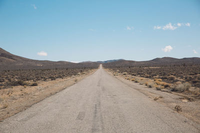 Road amidst landscape against sky