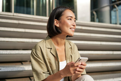 Young woman using mobile phone