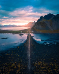 Scenic view of lake against sky during sunset