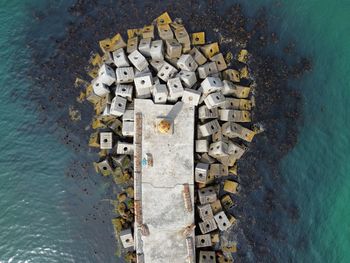 High angle view with lighthouse, rocks and sea 