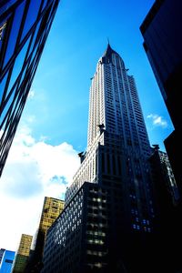 Low angle view of buildings against blue sky