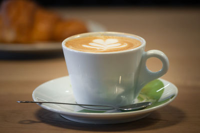 Close-up of coffee cup on table