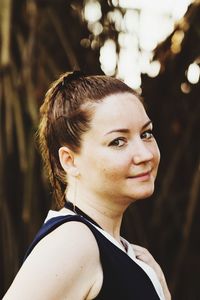 Portrait of a smiling young woman looking away