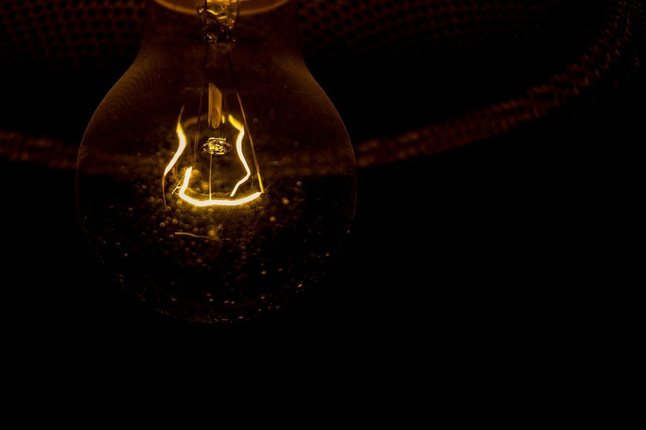 CLOSE-UP OF ILLUMINATED LIGHT BULBS