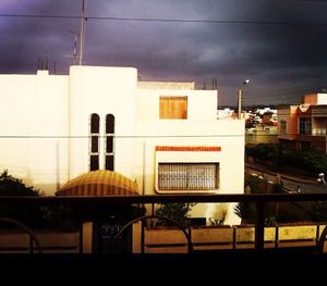 View of buildings against cloudy sky