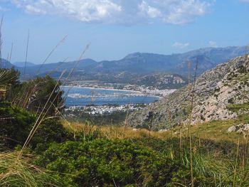 Scenic view of calm lake against mountain range