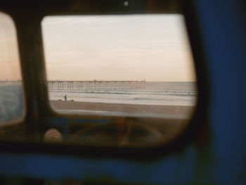 Scenic view of sea seen through window