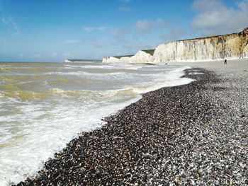 Scenic view of beach against sky