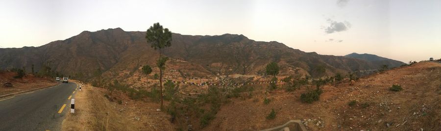 Panoramic view of mountain road against sky