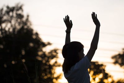 Rear view of silhouette people against blurred background