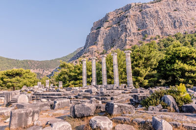 Old ruins on mountain against sky