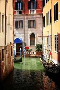 Canal amidst buildings in city