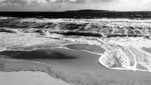 Close-up of beach against sky