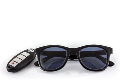 Close-up of sunglasses against white background