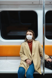 Woman sitting in train