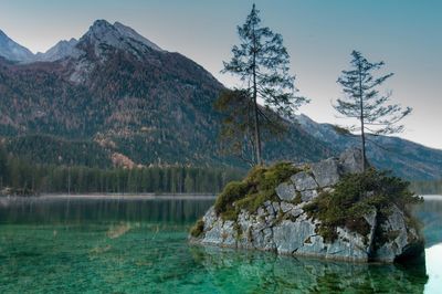 Scenic view of lake and mountains against sky