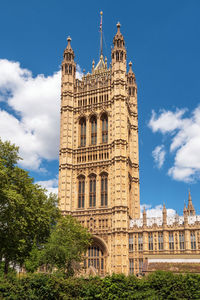 Low angle view of building against blue sky