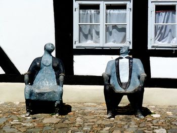 Rear view of a men looking through window