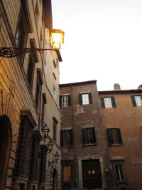 Low angle view of buildings against clear sky