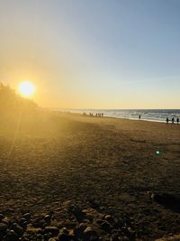 Scenic view of sea against clear sky during sunset