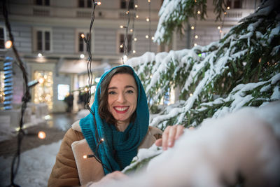 Portrait of smiling woman in snow