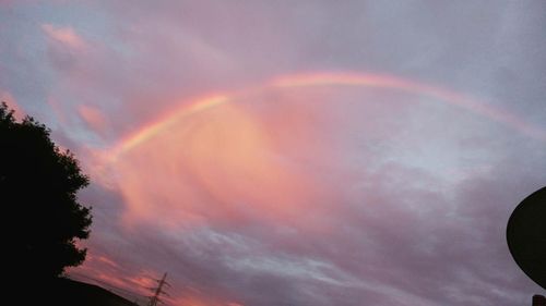 Low angle view of rainbow in sky