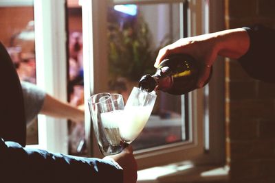 Cropped hand of man holding wineglass