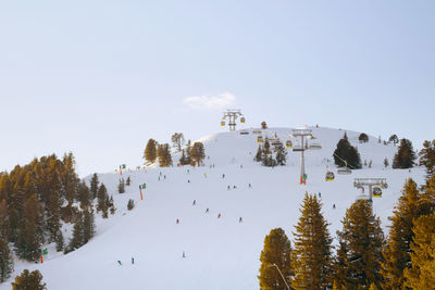 Panoramic view of ski lift against clear sky