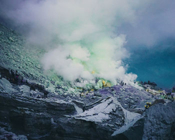 Aerial view of volcanic landscape against sky